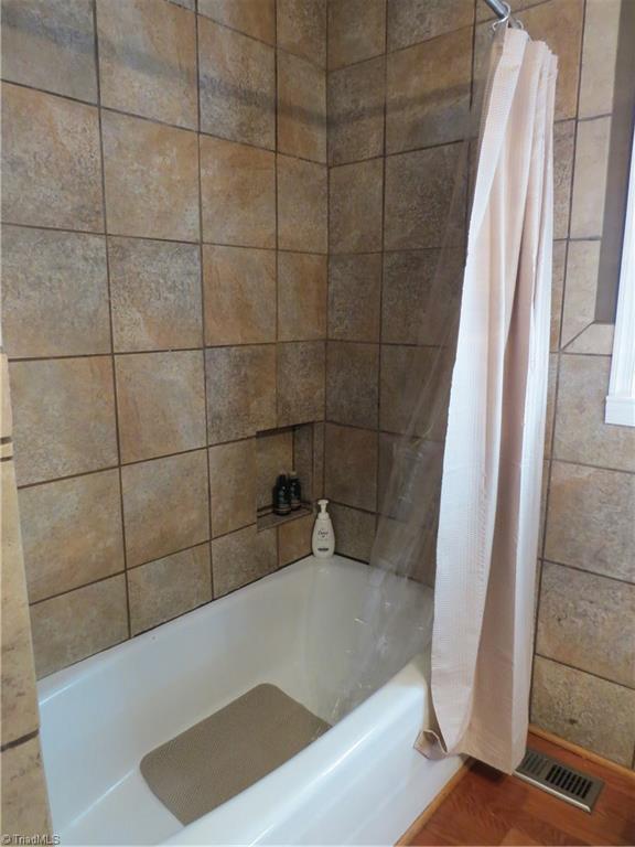 2881 Swallow Road Reidsville, NC 27320 - Photo 12 of 16 Bathtub with gorgeous tile surround.
