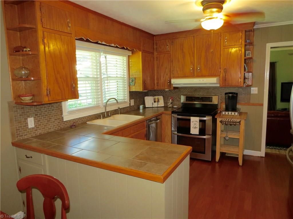 2881 Swallow Road Reidsville, NC 27320 - Photo 3 of 16 Gorgeous kitchen with tile countertops and backsplash