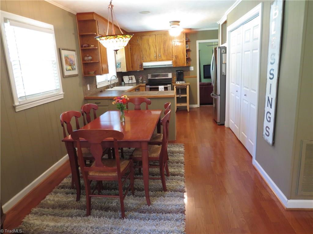 2881 Swallow Road Reidsville, NC 27320 - Photo 4 of 16 Kitchen / Dining room area with view of pantry and beautiful hardwood floors
