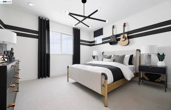 a bedroom with a bed and ceiling fan