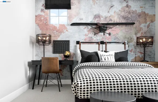 a bedroom with a bed and a chair