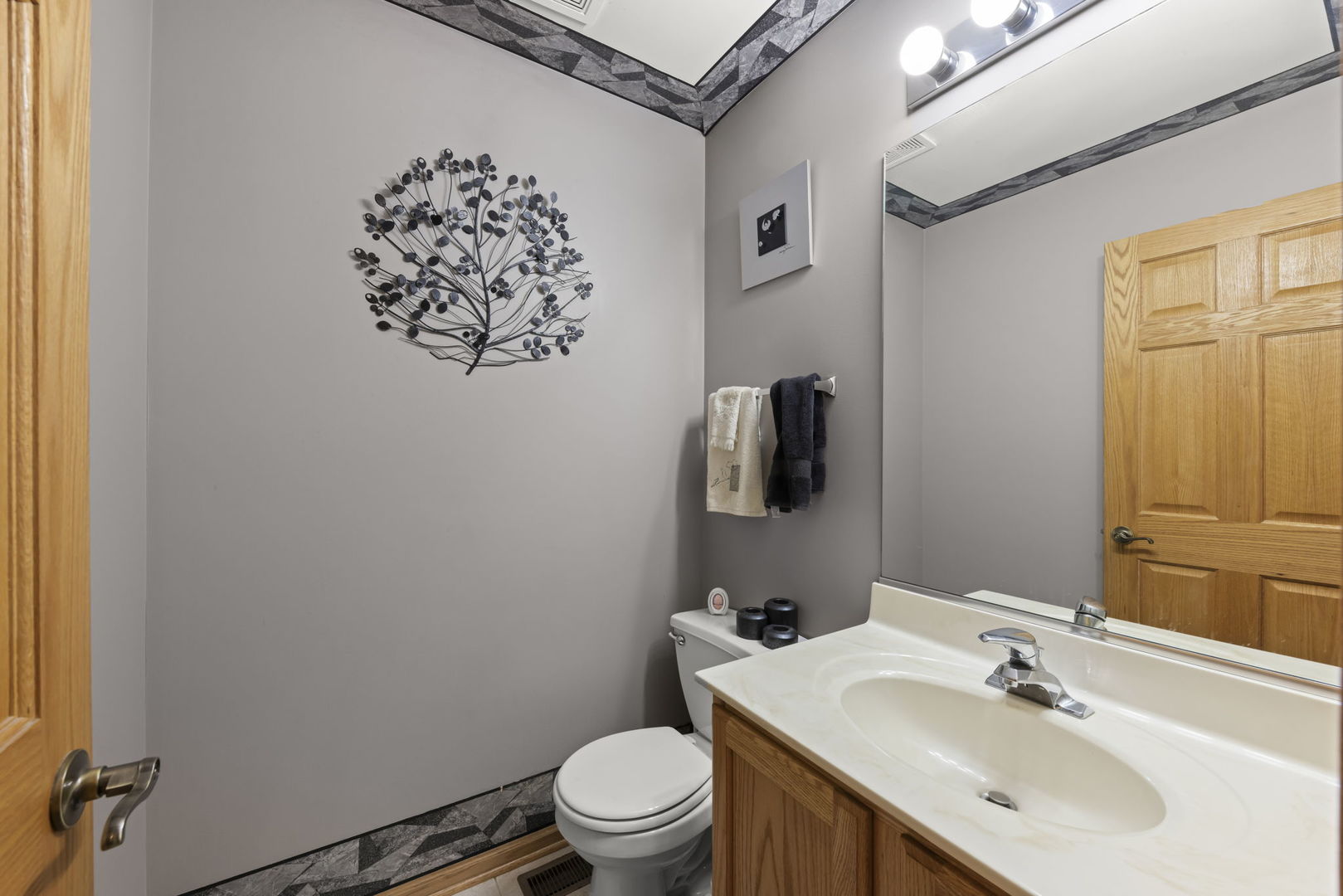 2217 Cedar Ridge Drive Plainfield, IL 60586 - Photo 12 of 26 a bathroom with a sink mirror vanity and toilet