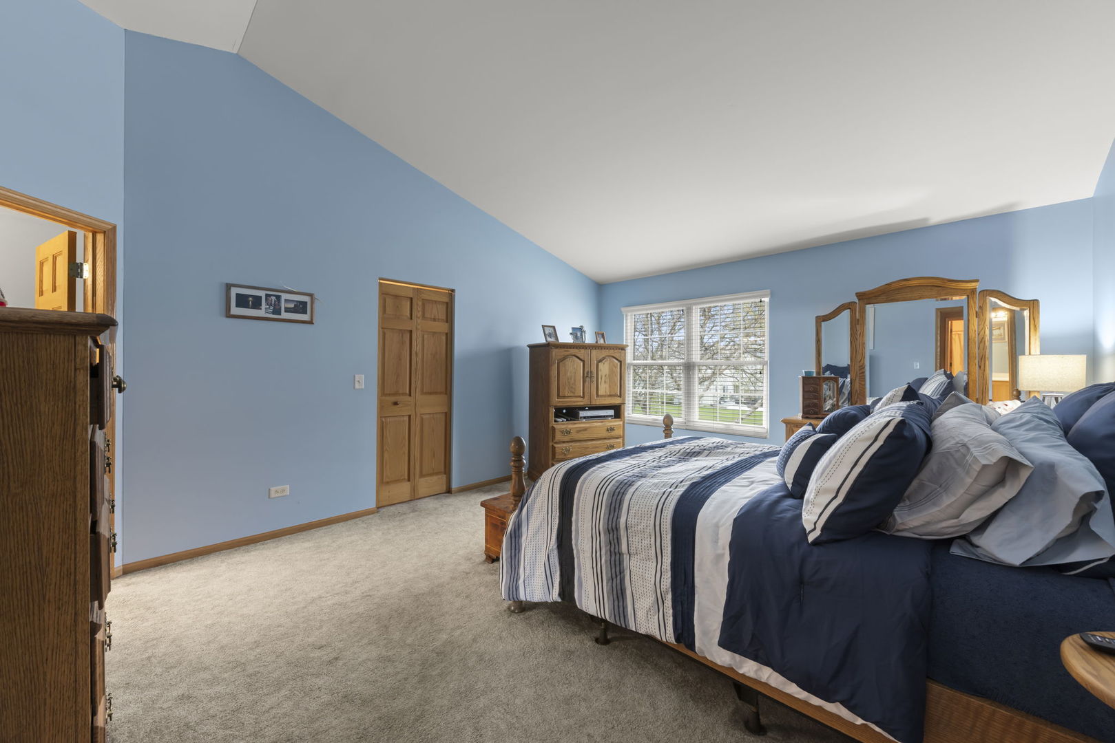 2217 Cedar Ridge Drive Plainfield, IL 60586 - Photo 14 of 26 a bed room with a bed and a lamp
