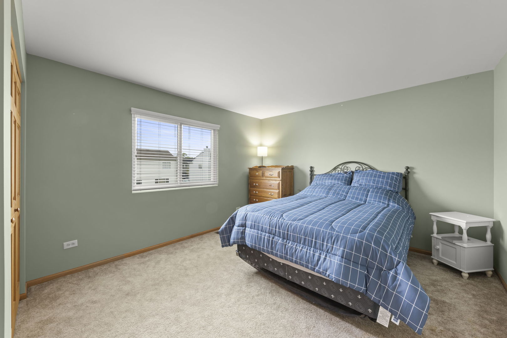 2217 Cedar Ridge Drive Plainfield, IL 60586 - Photo 19 of 26 a bedroom with a bed and window