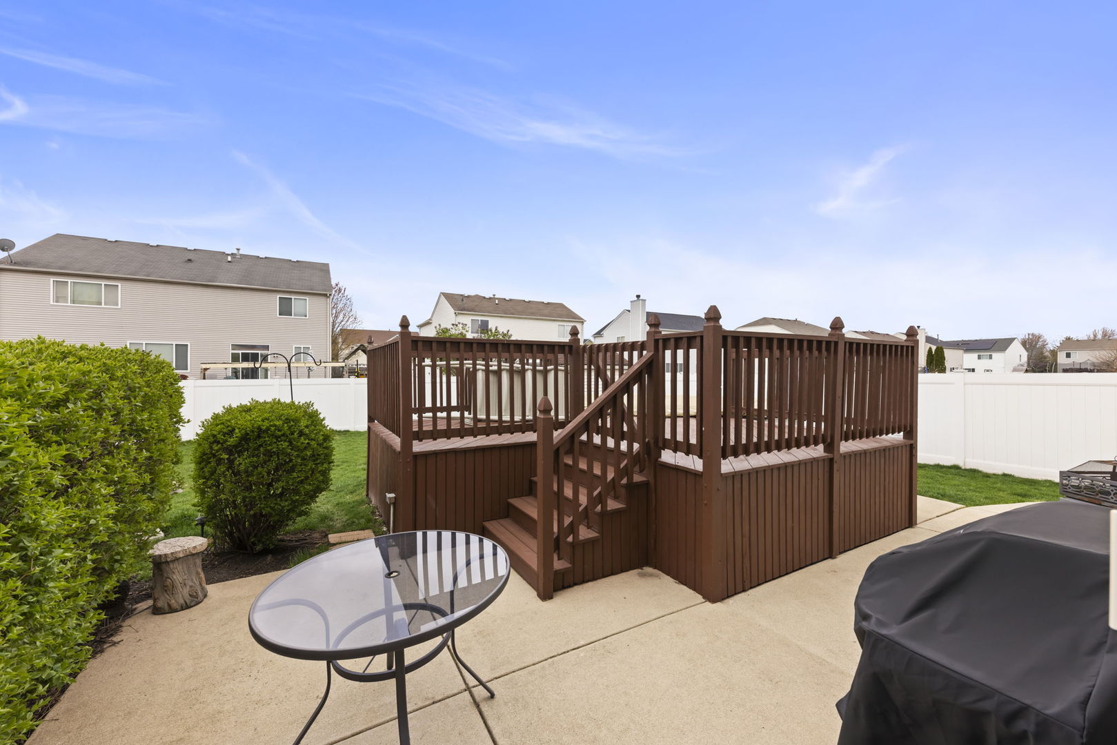 2217 Cedar Ridge Drive Plainfield, IL 60586 - Photo 25 of 26 a view of a chairs and table in the patio