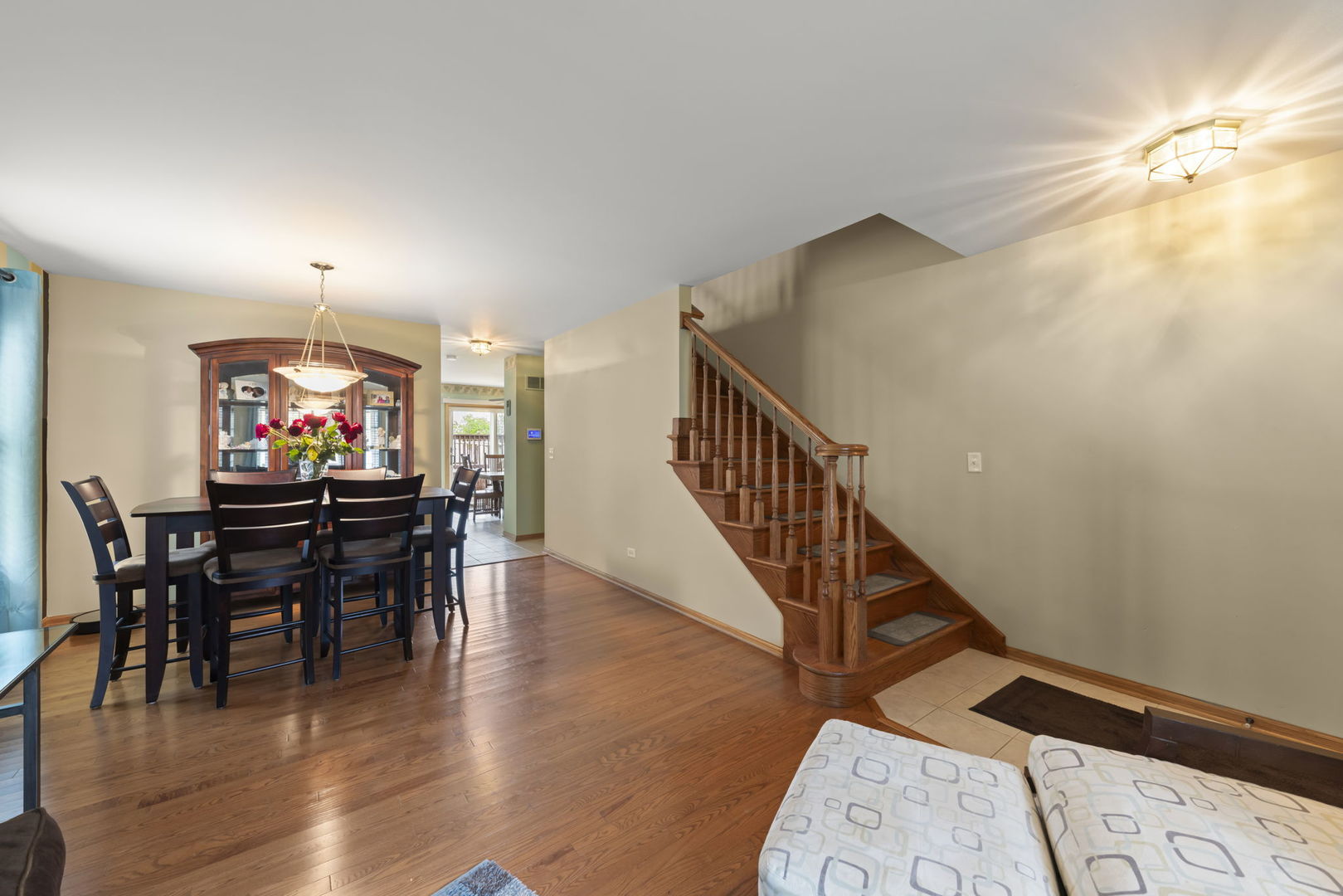 2217 Cedar Ridge Drive Plainfield, IL 60586 - Photo 3 of 26 a view of a dining room with furniture and wooden floor