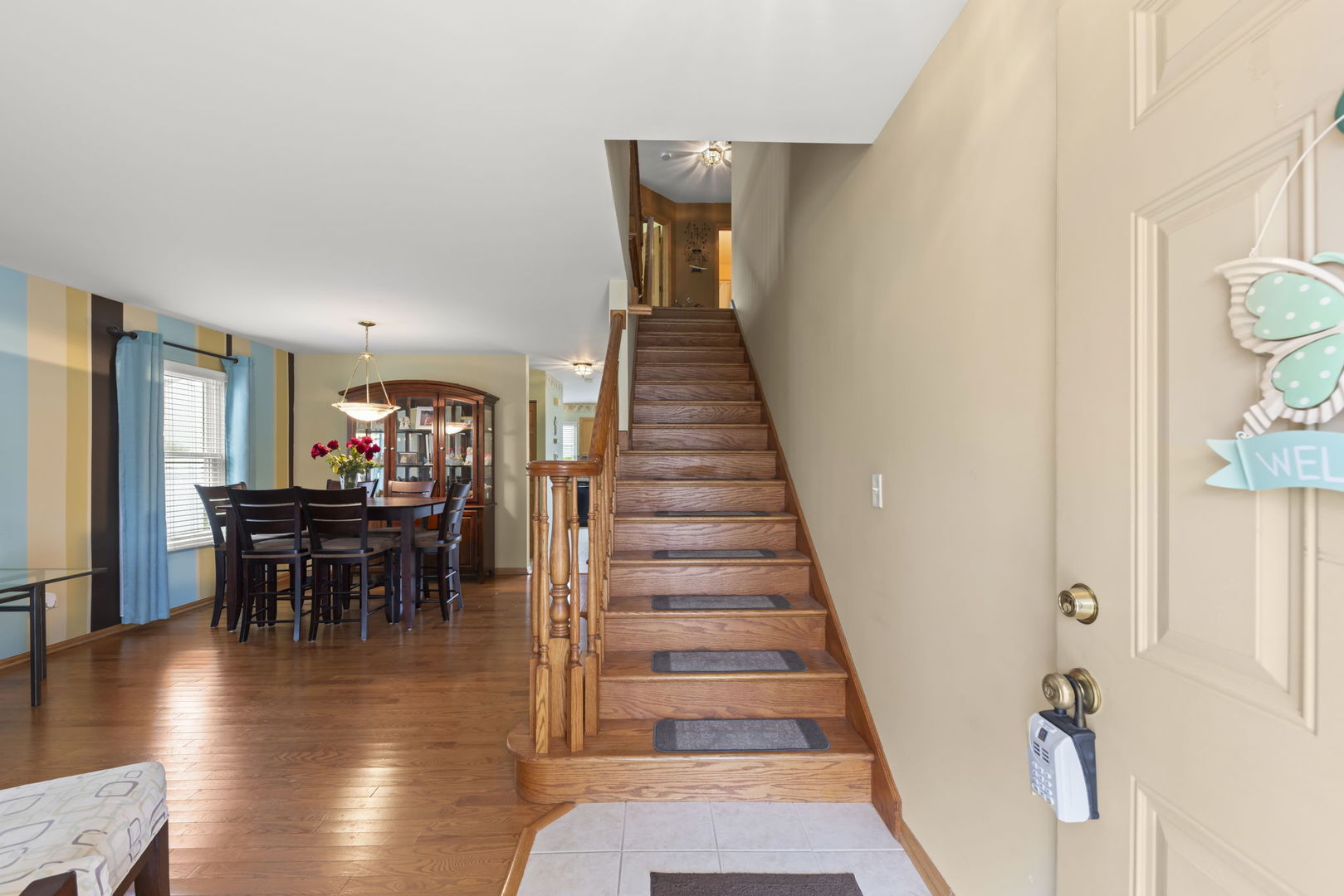 2217 Cedar Ridge Drive Plainfield, IL 60586 - Photo 5 of 26 a view of a livingroom with furniture wooden floor and stairs