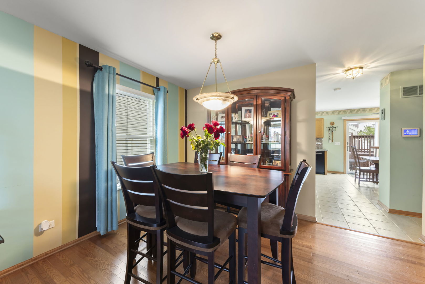 2217 Cedar Ridge Drive Plainfield, IL 60586 - Photo 6 of 26 a view of a dining room with furniture window and wooden floor