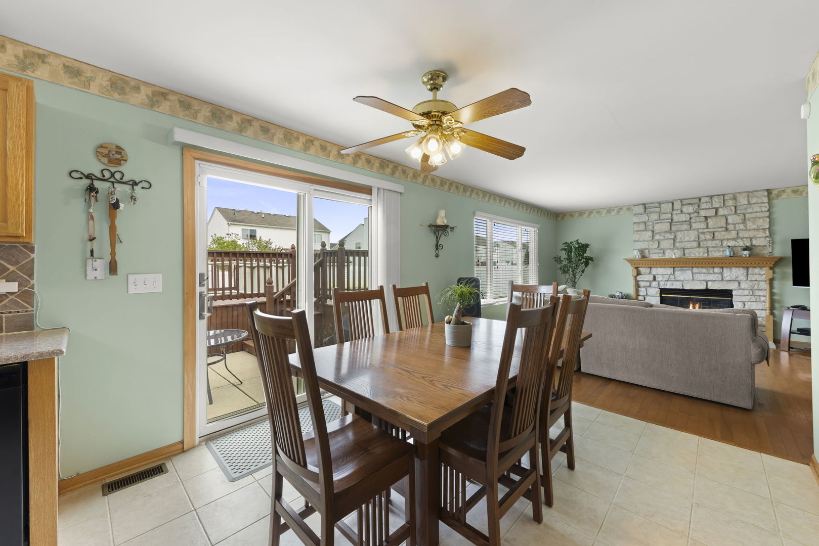 2217 Cedar Ridge Drive Plainfield, IL 60586 - Photo 9 of 26 a view of a dining room with furniture and a livingroom
