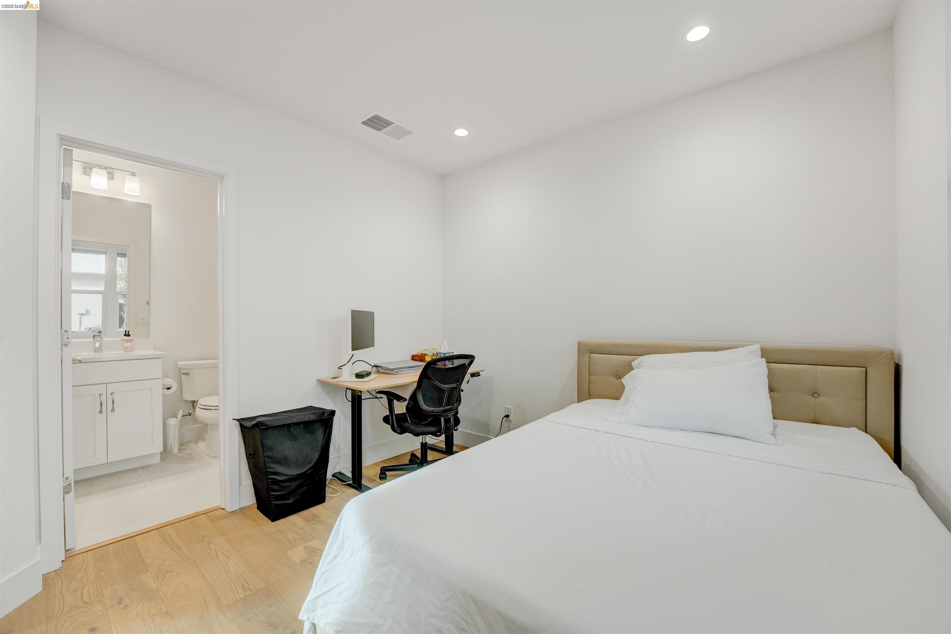 7101 Melon Court San Ramon, CA 94583 - Photo 7 of 58 a bedroom with a bed and a table in it