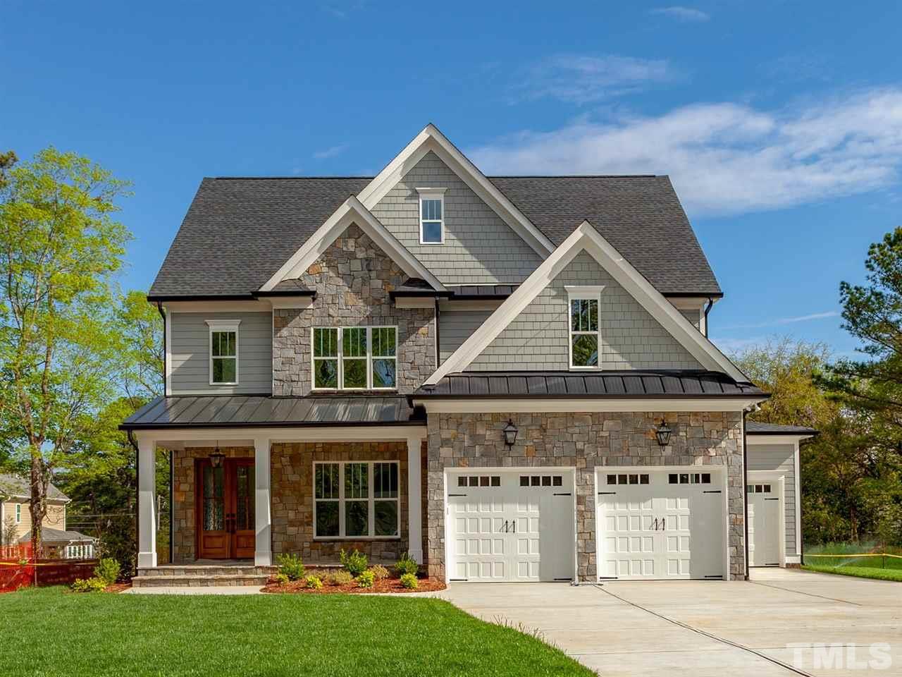 2804 Oberry Street Raleigh, NC 27607 - Photo 1 of 25 a front view of a house with garden