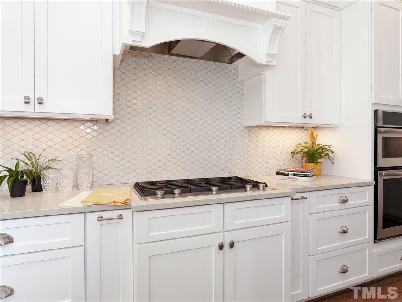 2804 Oberry Street Raleigh, NC 27607 - Photo 11 of 25 a kitchen with a sink and cabinets