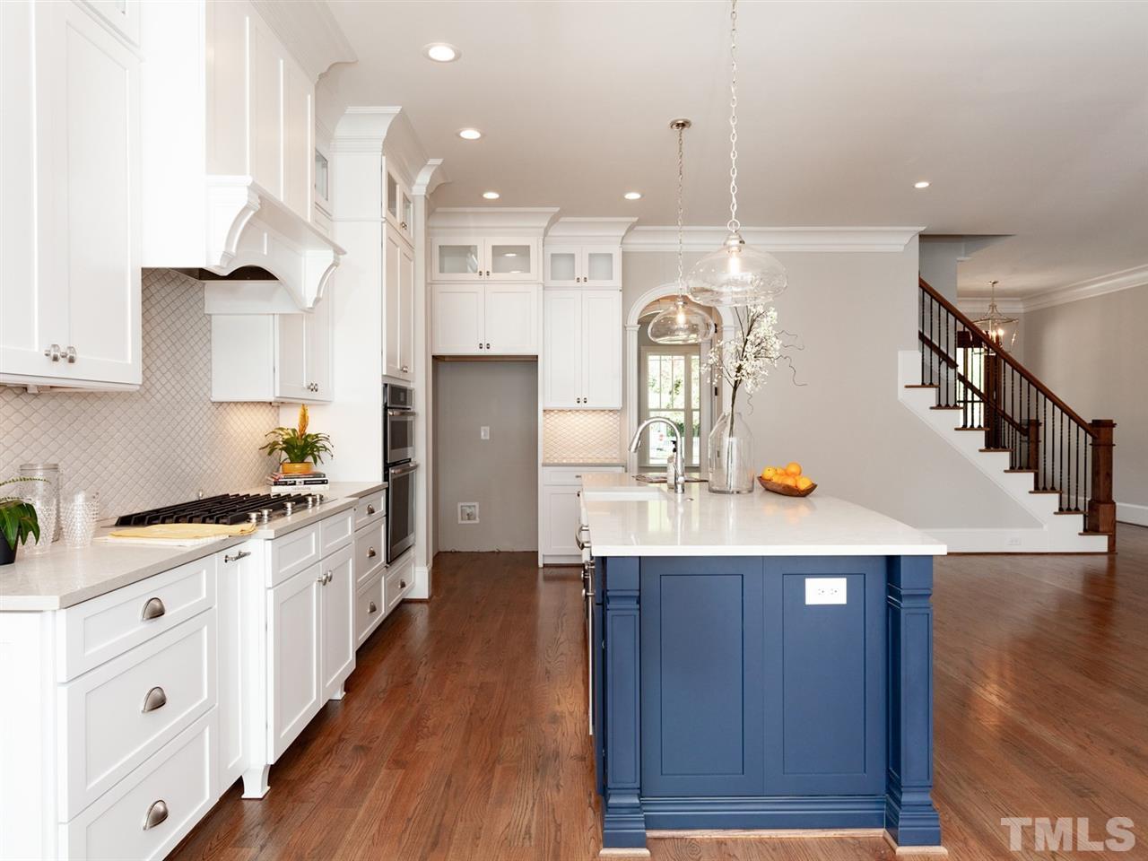 2804 Oberry Street Raleigh, NC 27607 - Photo 13 of 25 a kitchen with granite countertop a sink a counter space and stainless steel appliances