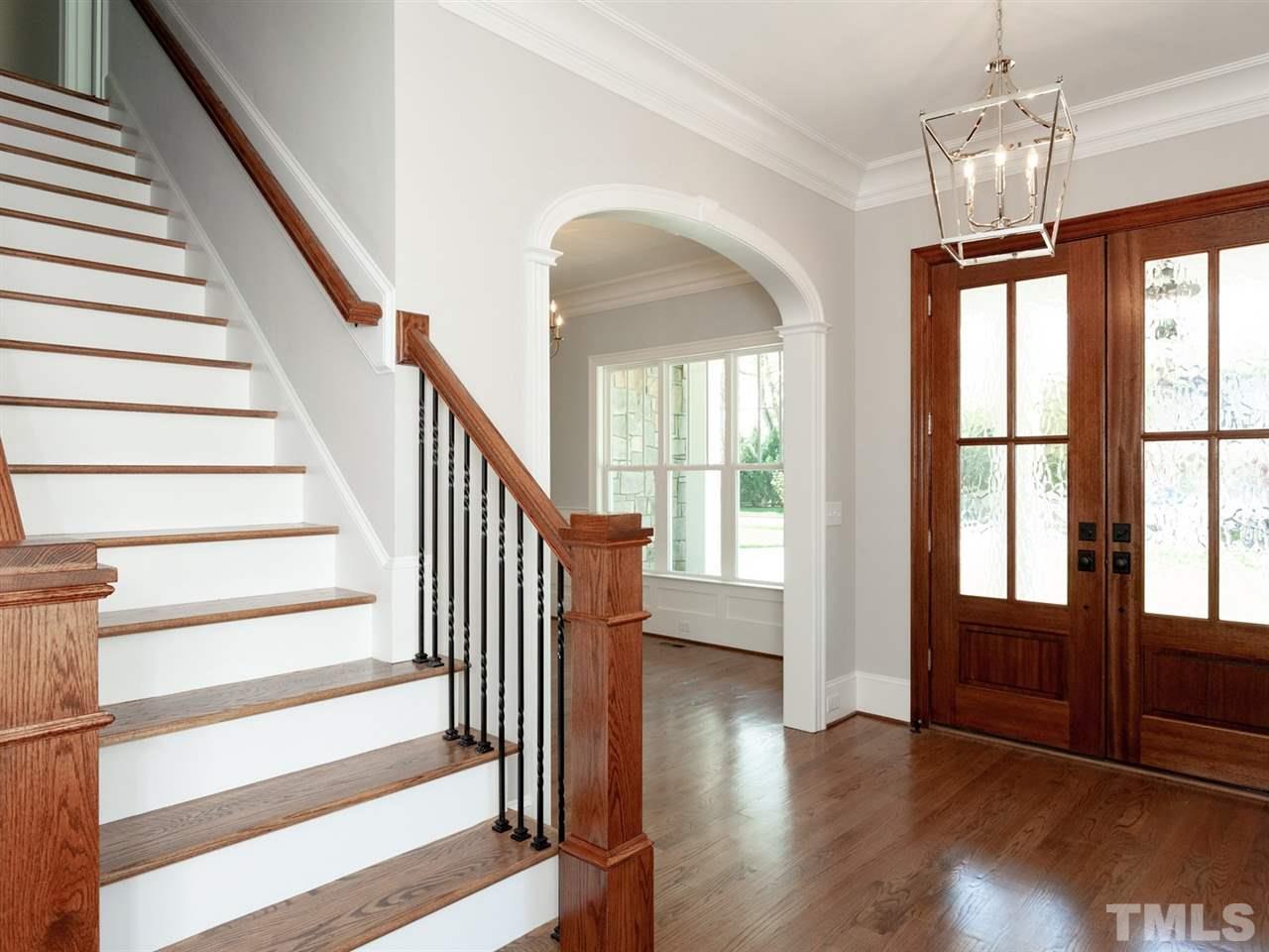 2804 Oberry Street Raleigh, NC 27607 - Photo 3 of 25 a view of front door with entryway and wooden floor