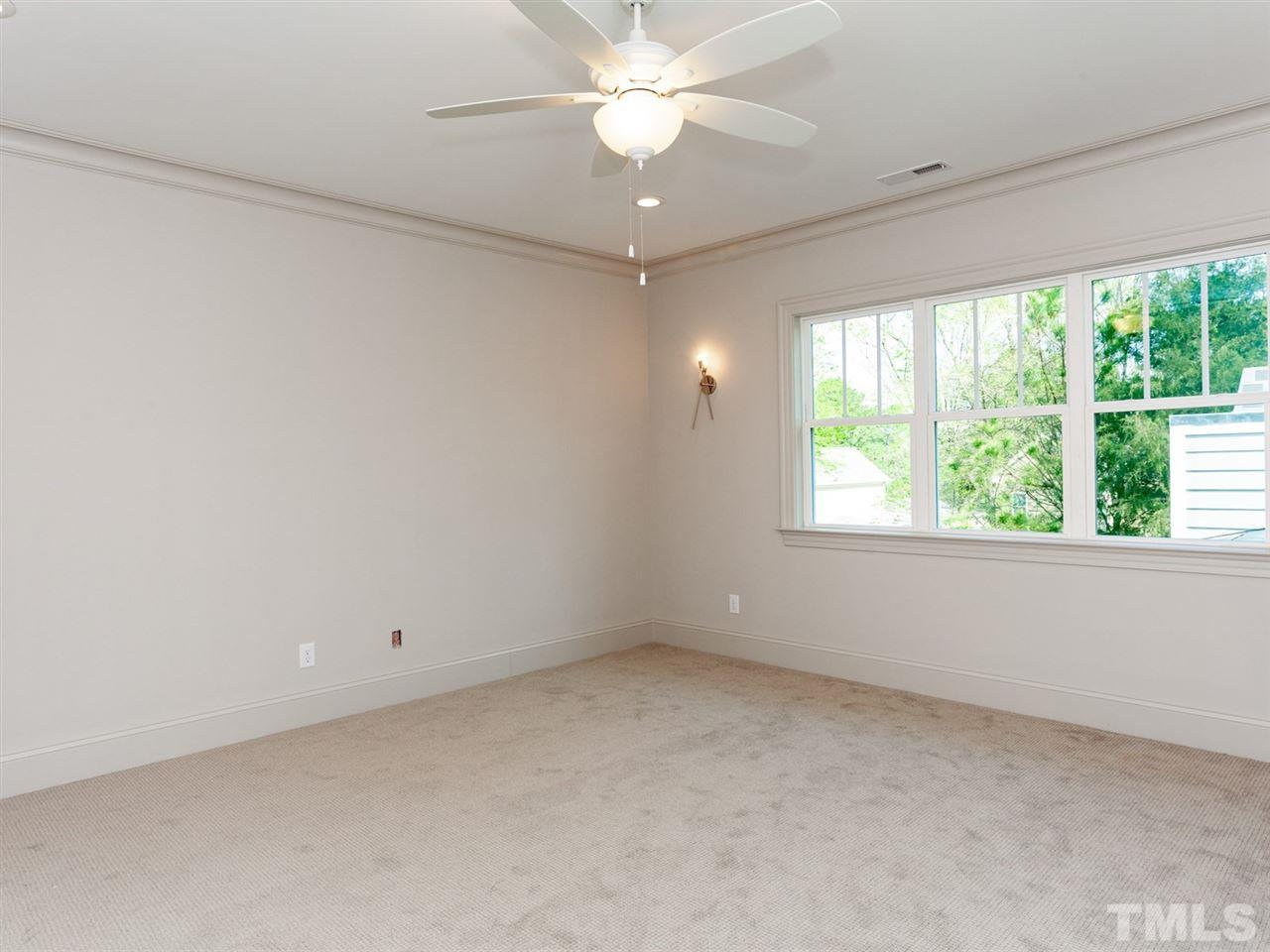 2804 Oberry Street Raleigh, NC 27607 - Photo 21 of 25 an empty room with a window and a ceiling fan