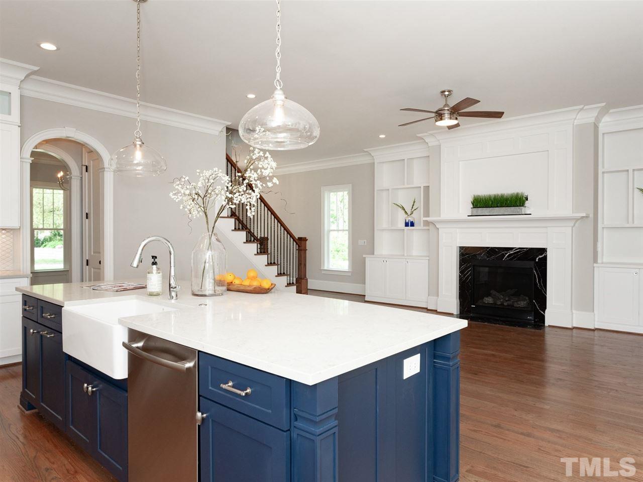 2804 Oberry Street Raleigh, NC 27607 - Photo 6 of 25 a kitchen with sink cabinets and wooden floor