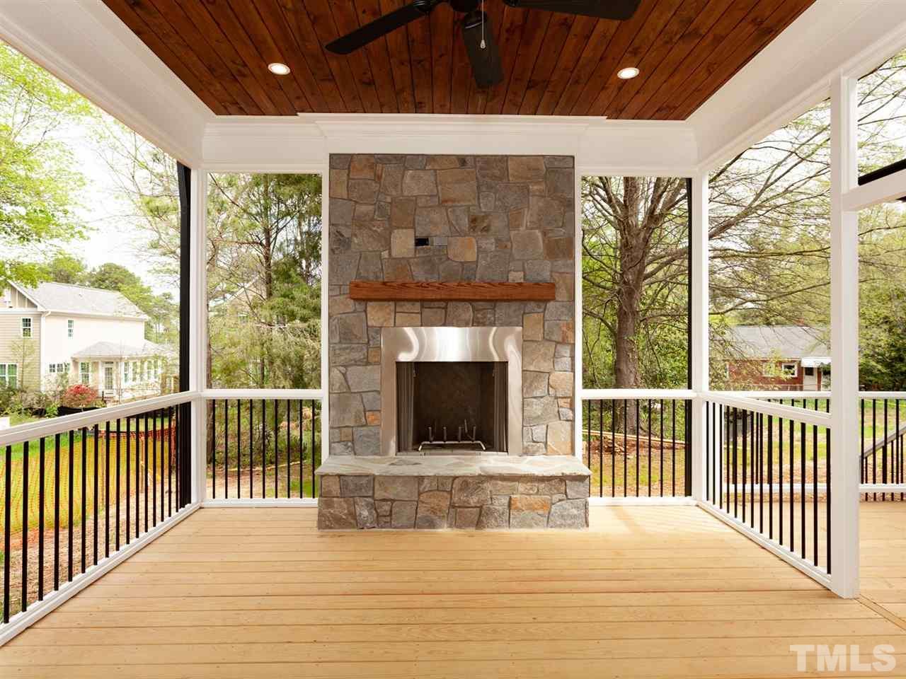 2804 Oberry Street Raleigh, NC 27607 - Photo 8 of 25 a view of a balcony with a floor to ceiling window and wooden floor