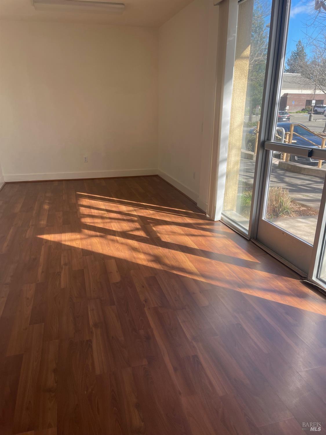 332 City Center Drive Rohnert Park, CA 94928 - Photo 3 of 10 a view of empty room with wooden floor and fan