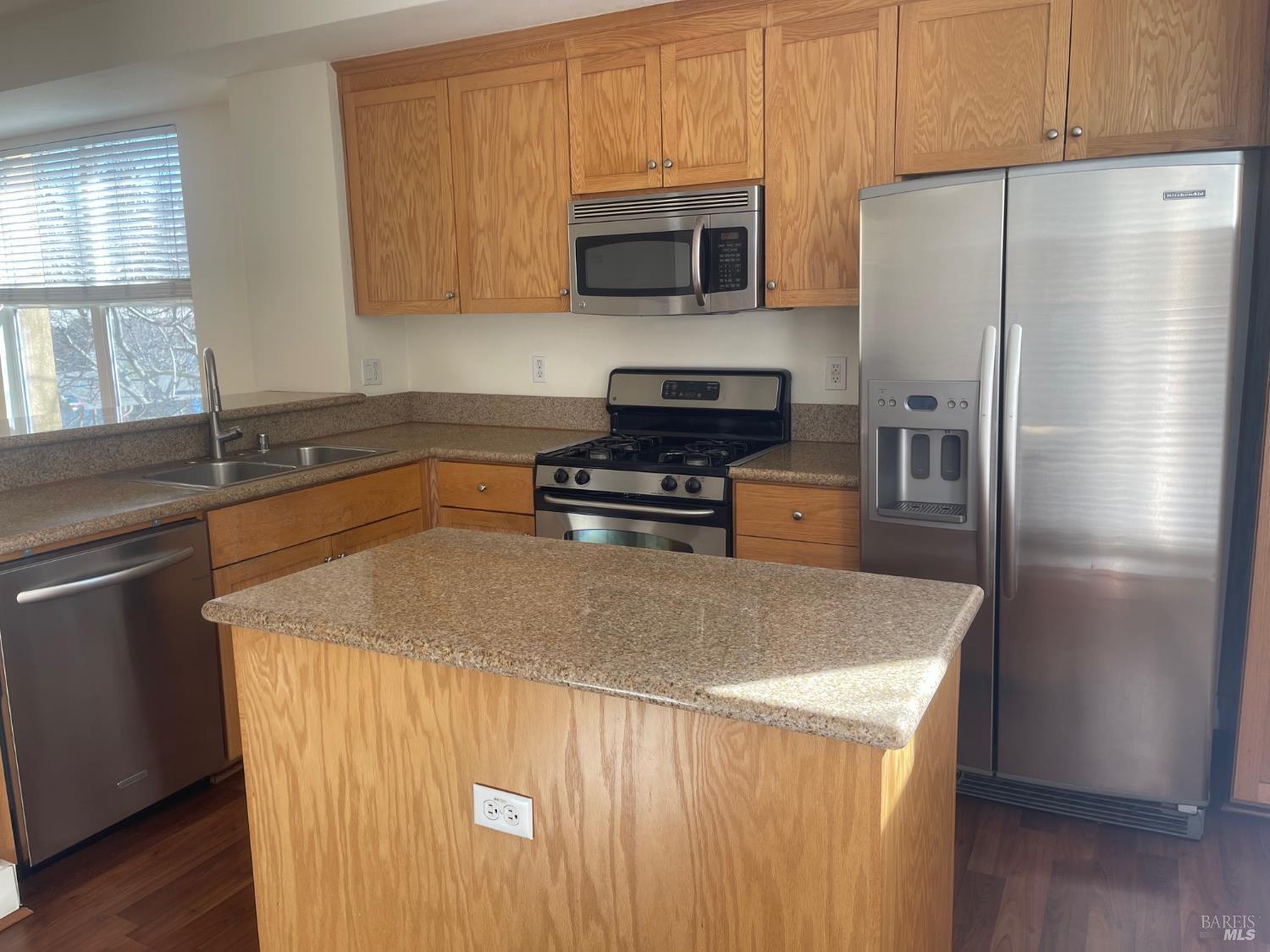 332 City Center Drive Rohnert Park, CA 94928 - Photo 6 of 10 a kitchen with a refrigerator a microwave a sink and cabinets