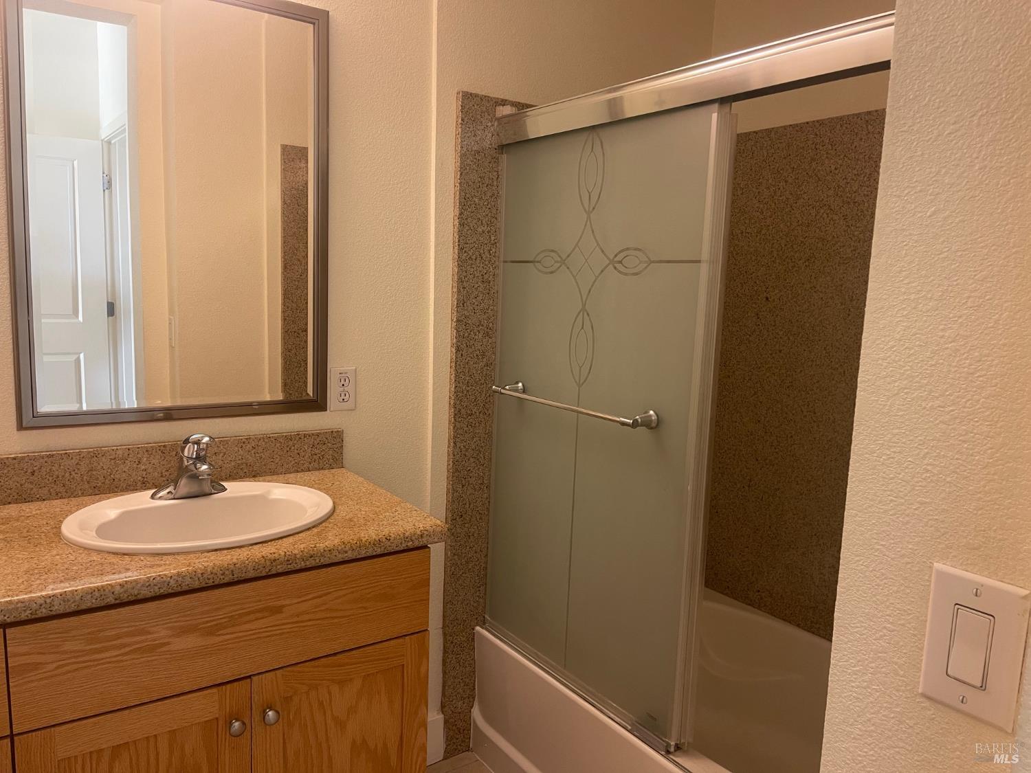 332 City Center Drive Rohnert Park, CA 94928 - Photo 9 of 10 a bathroom with a sink and a mirror
