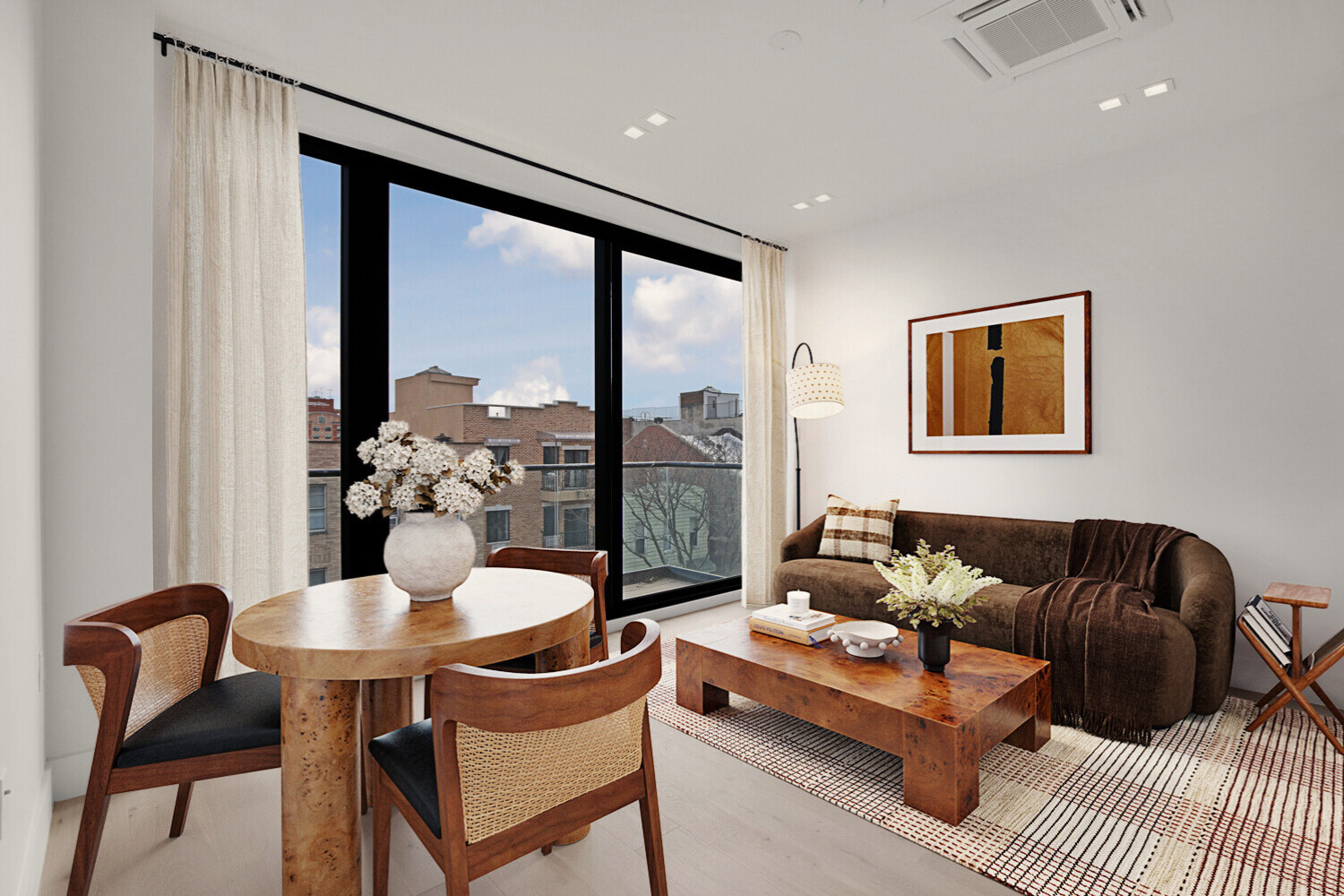 1003 Willoughby Avenue, Unit 3F Brooklyn, NY 11221 - Photo 3 of 9 a living room with furniture and a large window