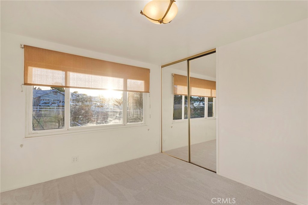 15177 Mendota Road North Apple Valley, CA 92307 - Photo 26 of 50 a view of an empty room with a window