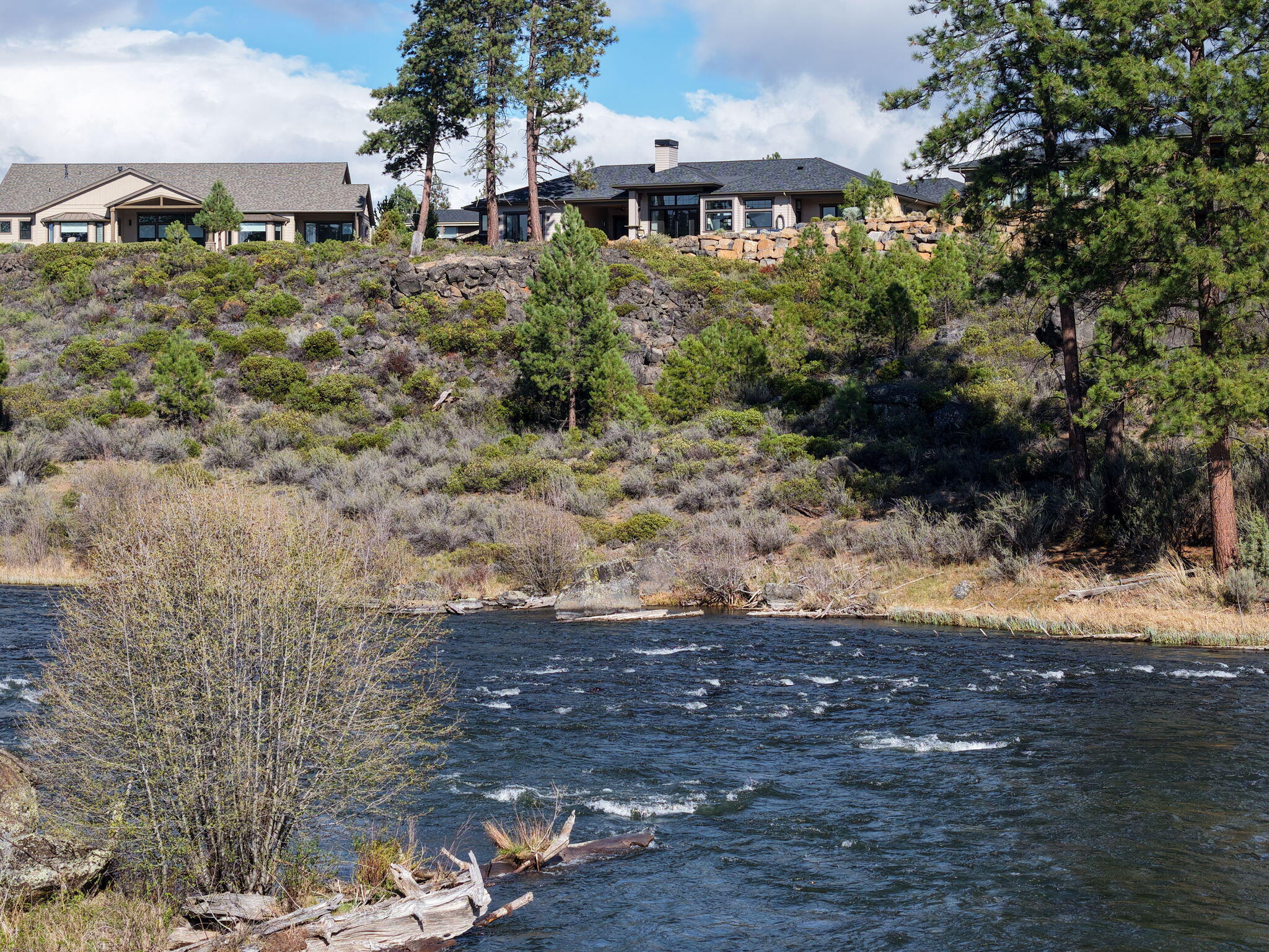 60871 River Rim Drive Bend, OR 97702 - Photo 40 of 42 a front view of a house with a yard