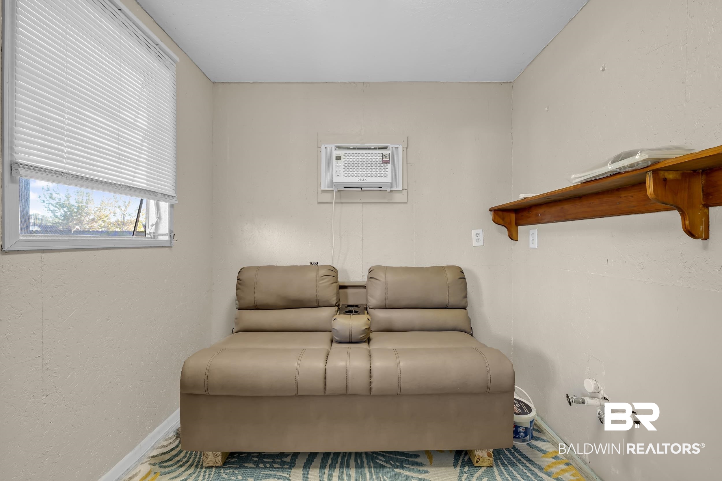 182 Defuniak Loop Lillian, AL 36549 - Photo 11 of 21 Sitting room featuring baseboards and a textured wall