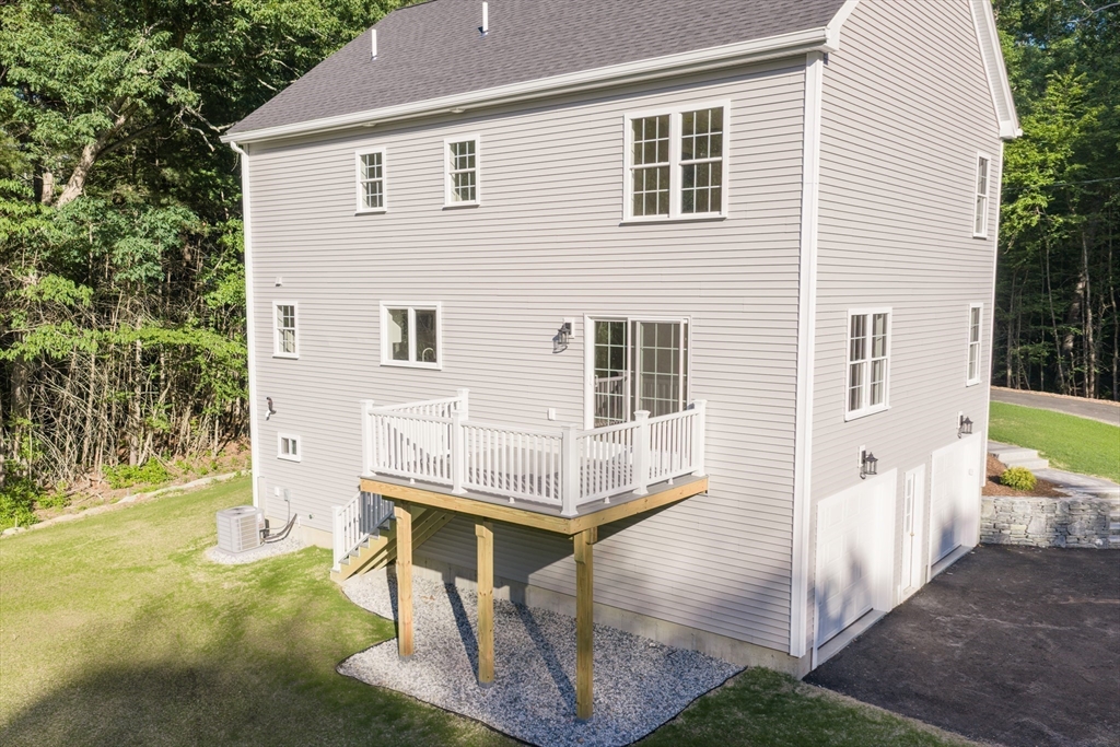 43 Martin Road Douglas, MA 01516 - Photo 7 of 38 a view of house with backyard and trees