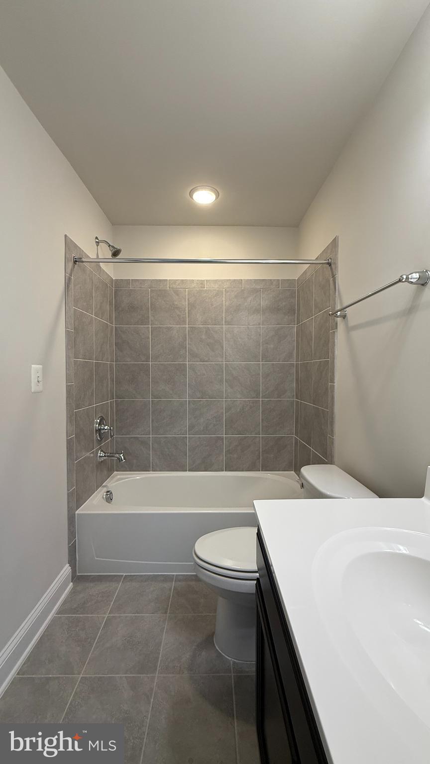 1949 Greenbriar Hall Road Dumfries, VA 22026 - Photo 23 of 26 a bathroom with a bathtub a sink a toilet and a shower