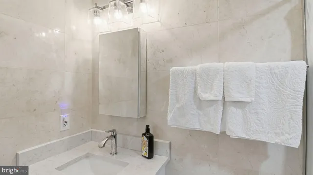 a bathroom with a bathtub and a sink