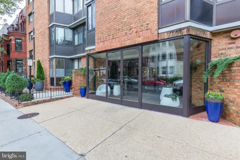 a view of a building with sitting area
