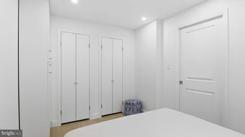 a bedroom with a bed and a closet