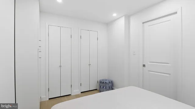 a bedroom with a bed and a closet