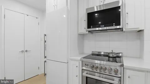 a kitchen with a stove and a microwave