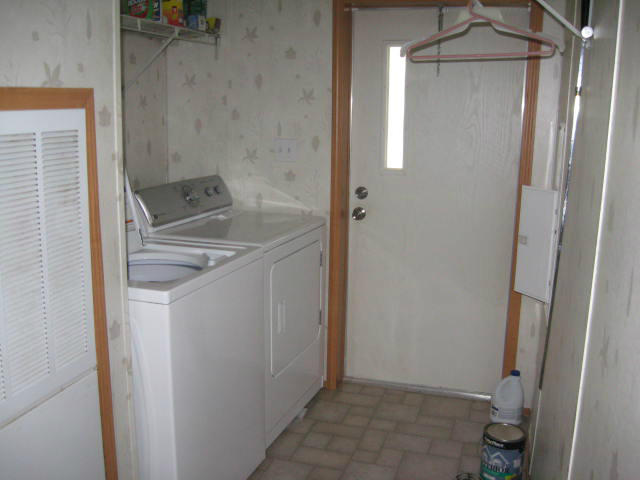 261 Munsons Road Penhook, VA 24137 - Photo 14 of 29 a bathroom with a sink and mirror