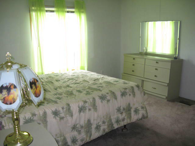 261 Munsons Road Penhook, VA 24137 - Photo 21 of 29 a bedroom with a bed and a window