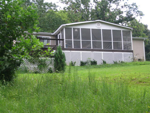 261 Munsons Road Penhook, VA 24137 - Photo 25 of 29 a front view of a house with a yard