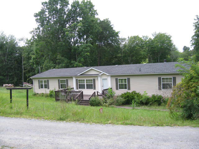 261 Munsons Road Penhook, VA 24137 - Photo 29 of 29 a front view of a house with a garden
