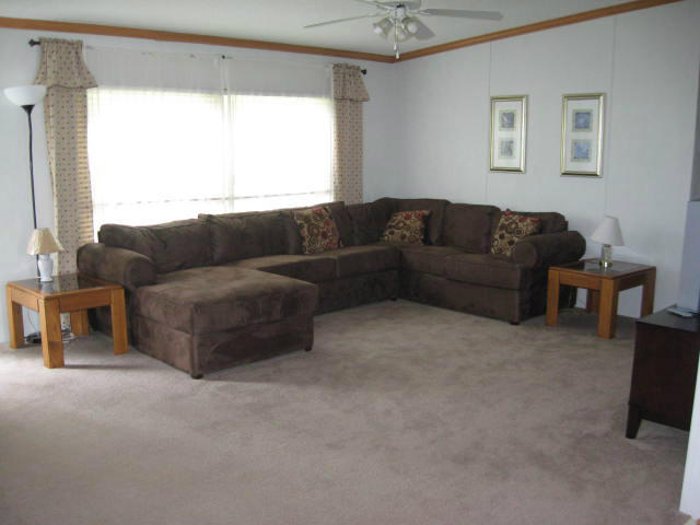 261 Munsons Road Penhook, VA 24137 - Photo 4 of 29 a living room with furniture and a large window