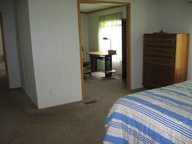 261 Munsons Road Penhook, VA 24137 - Photo 8 of 29 a bedroom with a bed and a television