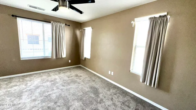 a view of an empty room and a window