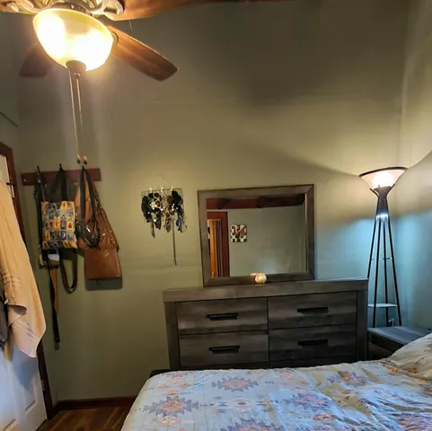 a room with a bed and a chandelier