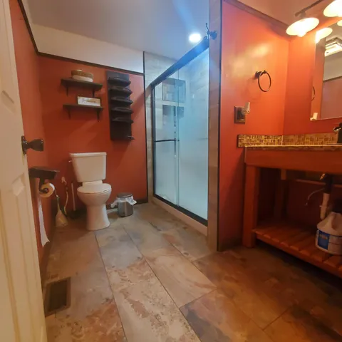 a bathroom with a toilet and a sink