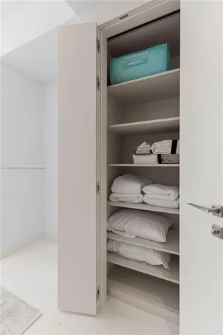 a view of a room with a large window