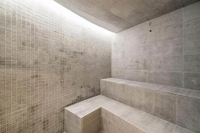 a room with furniture and a potted plant