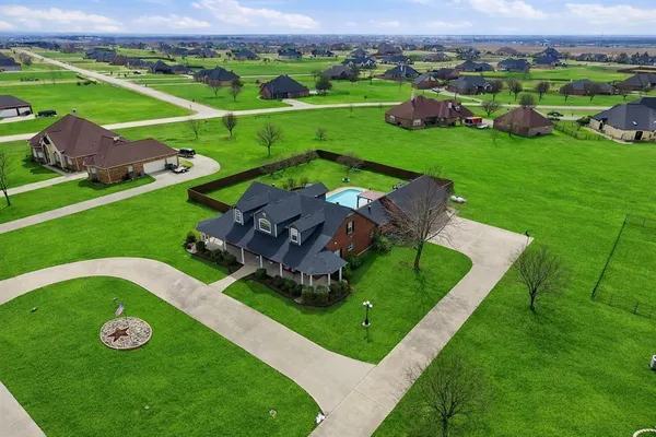 a front view of a house with a yard and porch