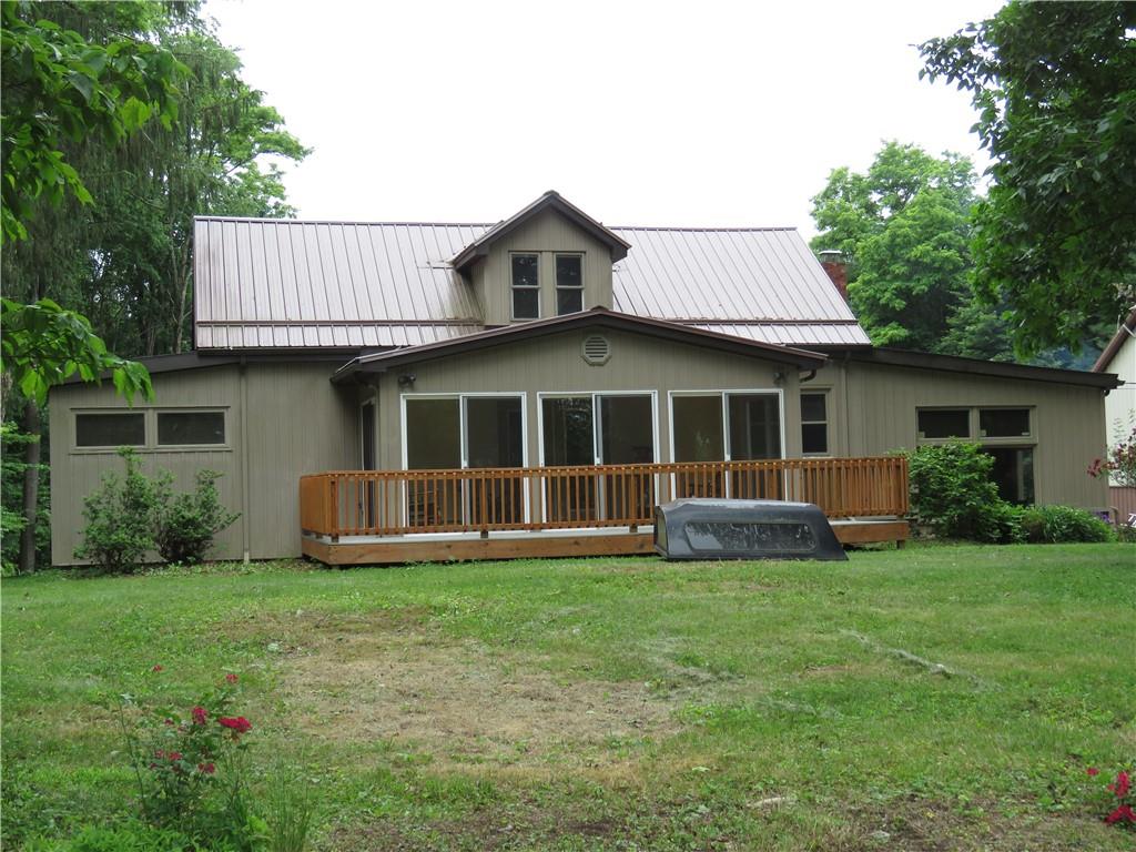 1225 Kentuck Road Ohiopyle, PA 15470 - Photo 1 of 24 a front view of a house with a yard and porch
