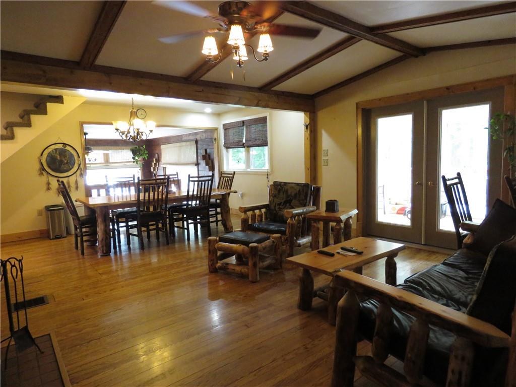 1225 Kentuck Road Ohiopyle, PA 15470 - Photo 11 of 24 a living room with lots of furniture and chandelier