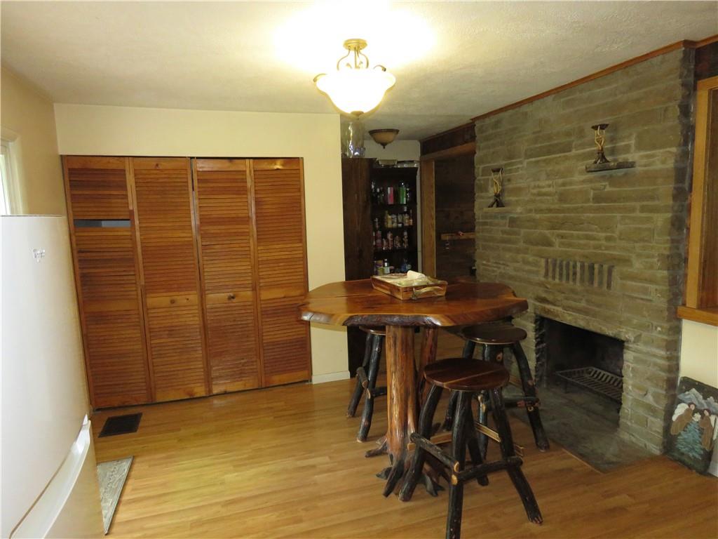 1225 Kentuck Road Ohiopyle, PA 15470 - Photo 6 of 24 a view of a dining room with furniture and chandelier